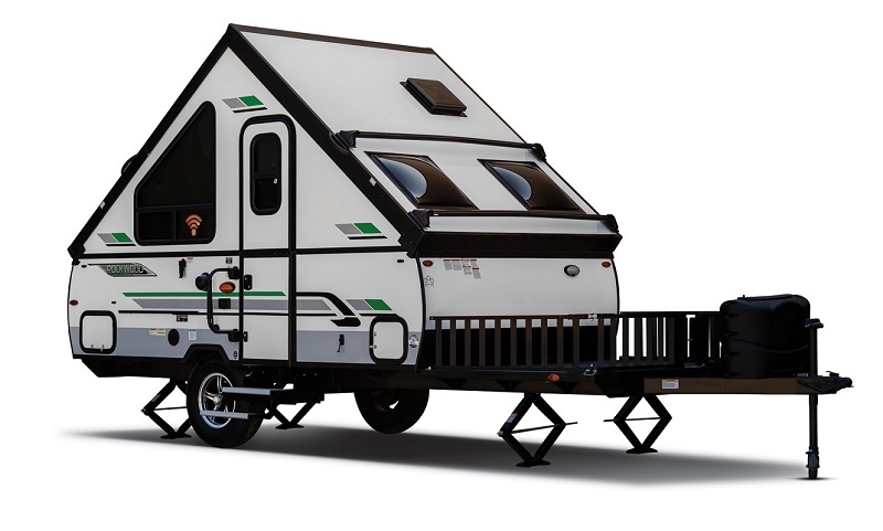 Hardsided camper leveled with jacks.